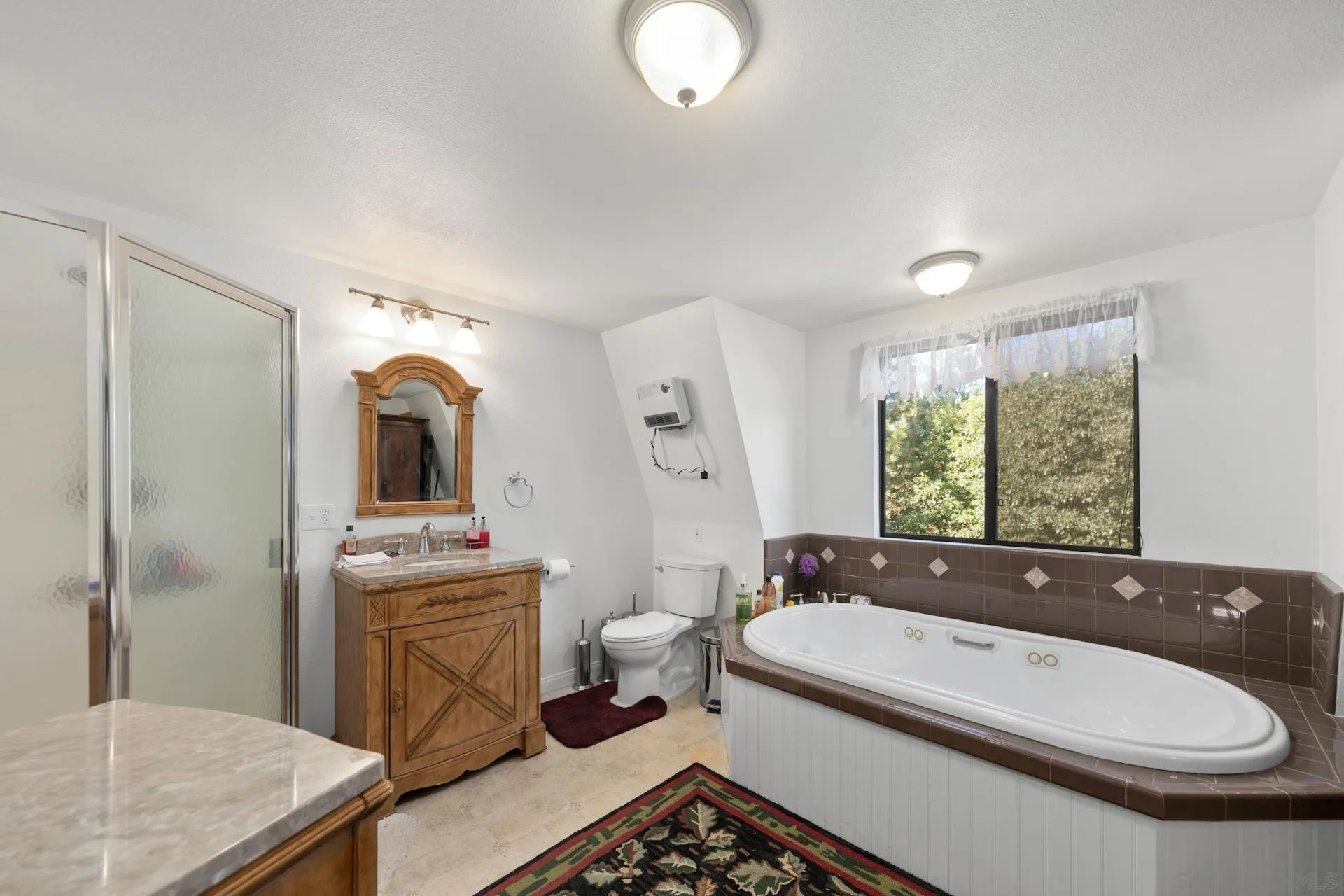 8203 Morris Ranch Road Pine Valley, CA 91962 - Photo 20 of 42 a bathroom with a granite countertop sink mirror bathtub and toilet