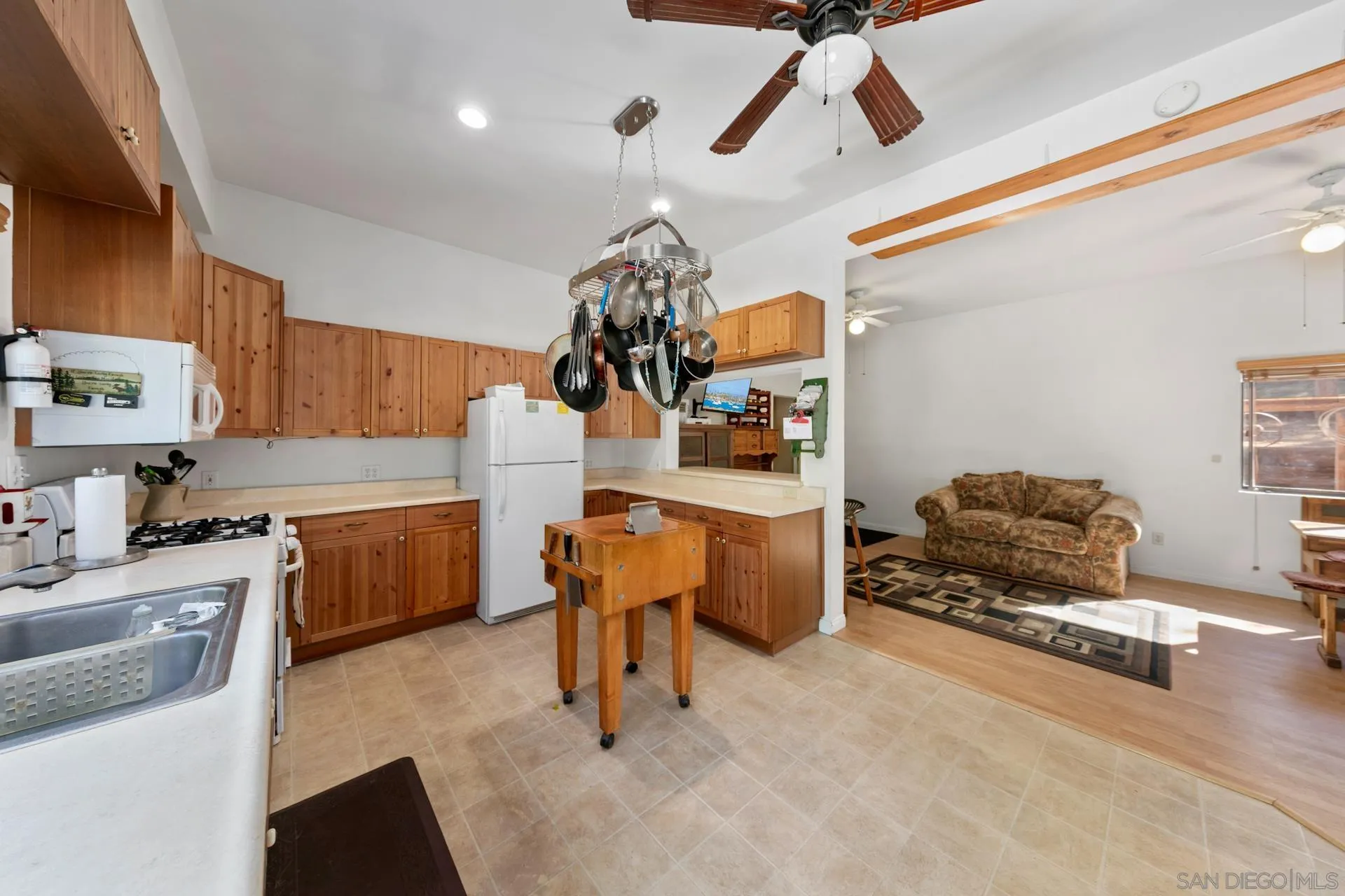 8203 Morris Ranch Road Pine Valley, CA 91962 - Photo 9 of 42 a kitchen with a refrigerator and a sink