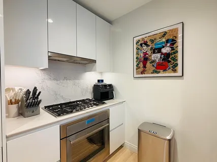 a kitchen with a stove and a refrigerator