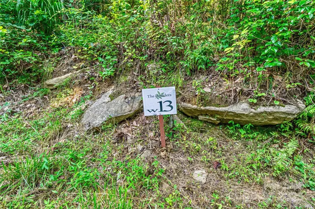 a sign board with a yard