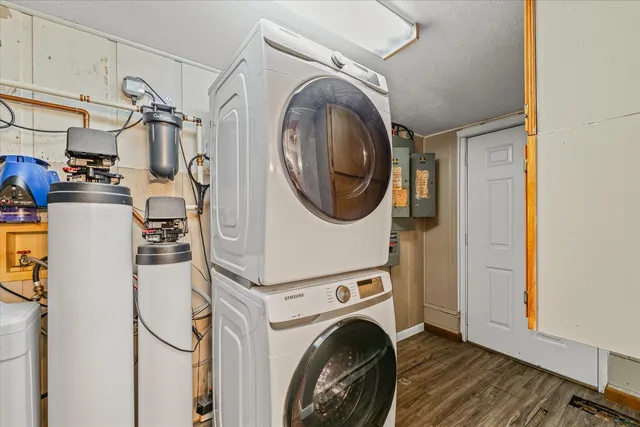 a kitchen with sink refrigerator and window