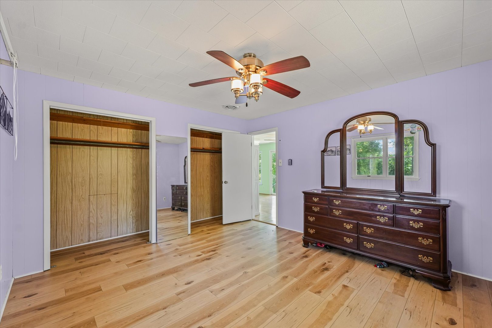 16322 Shangri La Road Oakwood, IL 61858 - Photo 26 of 42 a view of room with wooden floor and a ceiling fan
