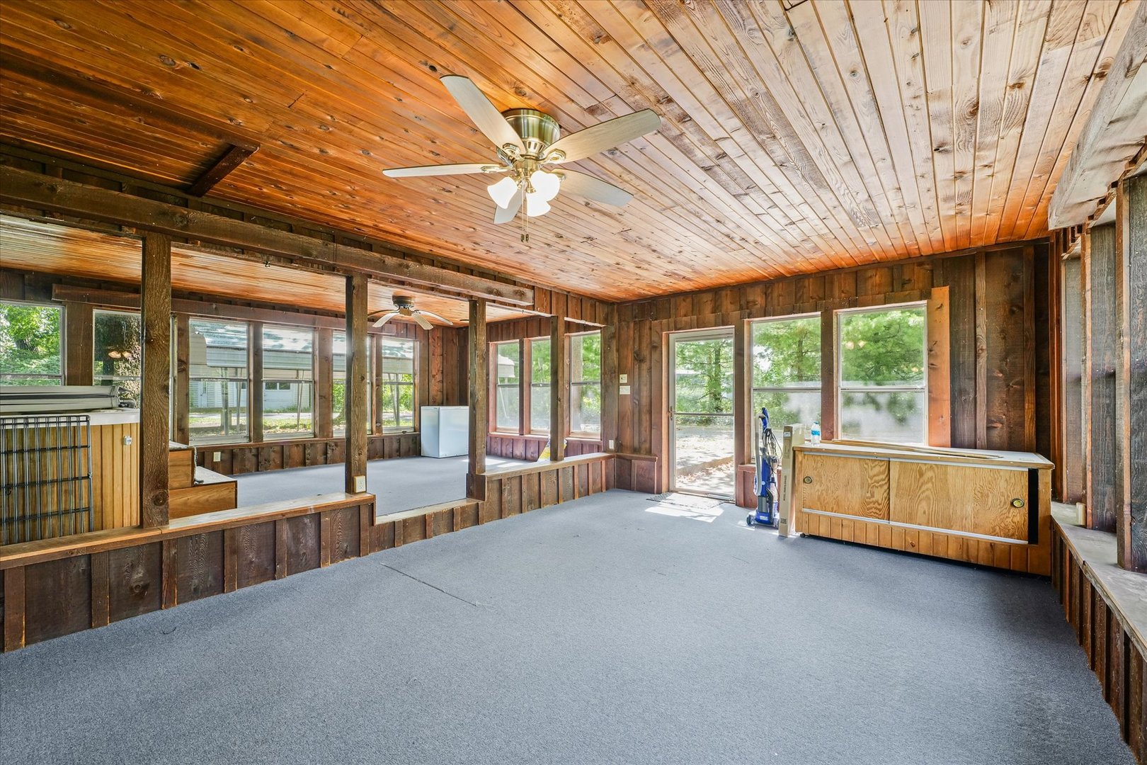 16322 Shangri La Road Oakwood, IL 61858 - Photo 31 of 42 a large room with a large window and furniture