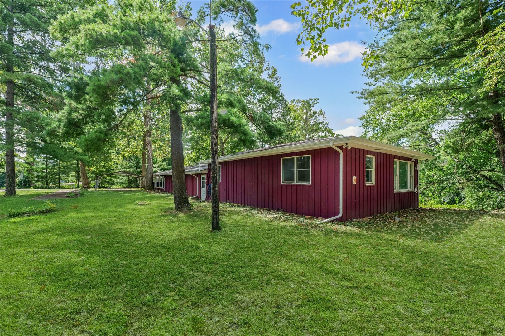 16322 Shangri La Road Oakwood, IL 61858 - Photo 39 of 42 a view of a backyard with large trees
