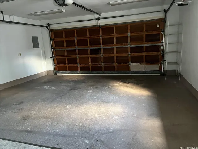 a view of an empty room with a empty space and a window
