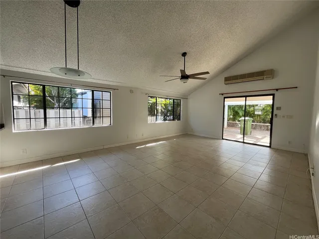 a view of an empty room with windows