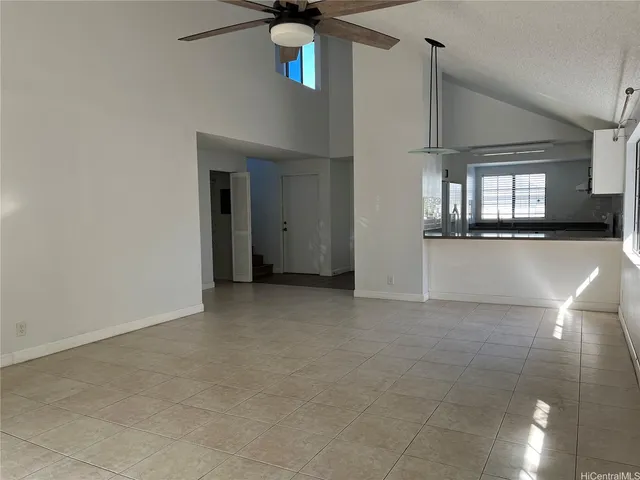 a view of a hallway with entryway and window