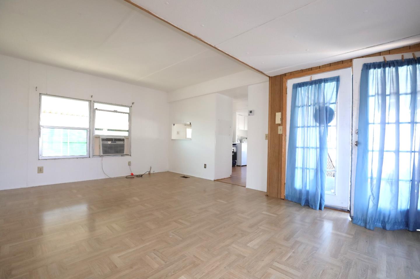 60 Wilson Way, Unit 70 Milpitas, CA 95035 - Photo 5 of 20 a view of an empty room with wooden floor and a window