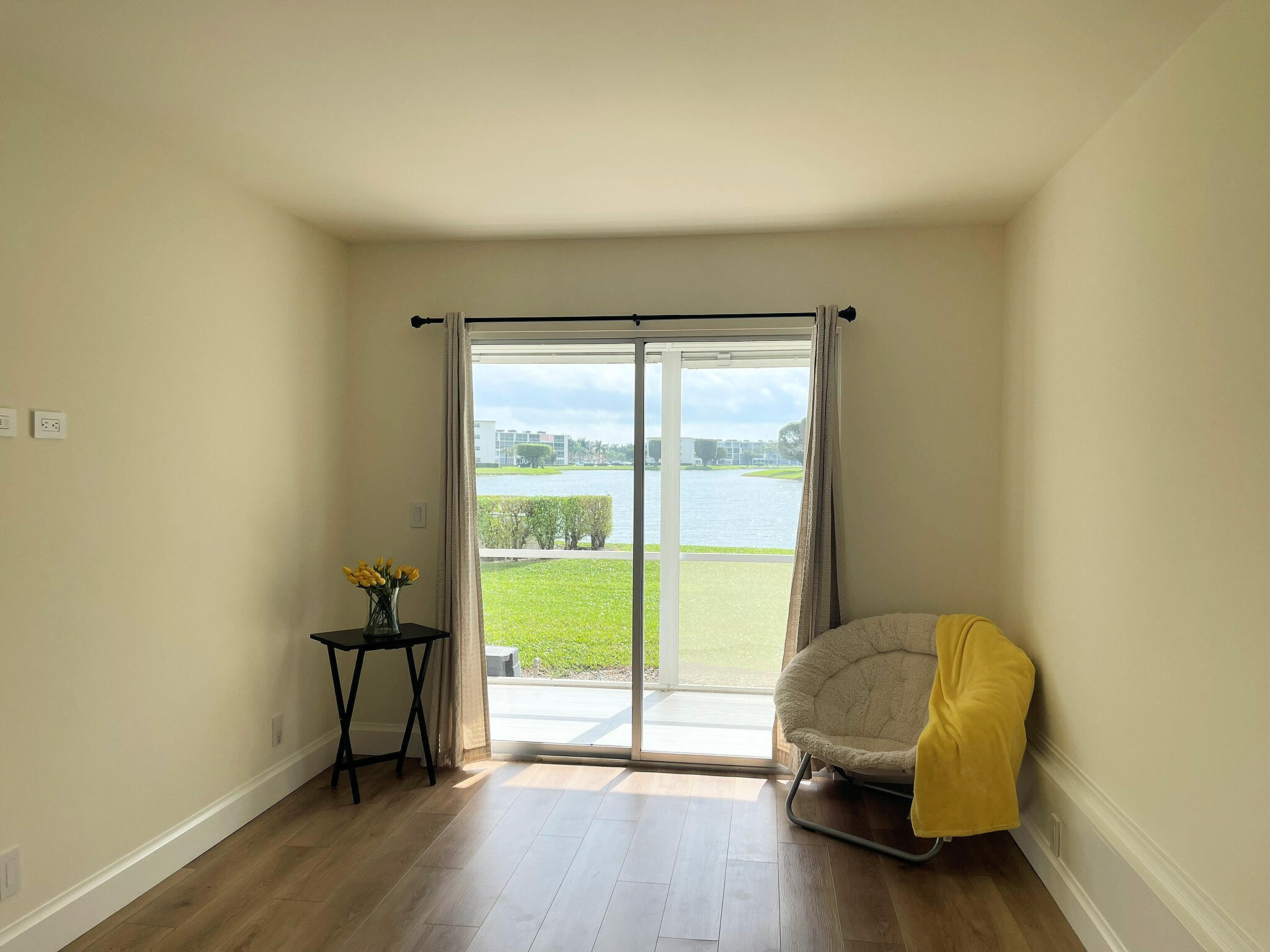 1030 Rexford B Boca Raton, FL 33434 - Photo 18 of 27 a living room with furniture and a window