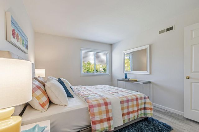 a bedroom with a bed and window