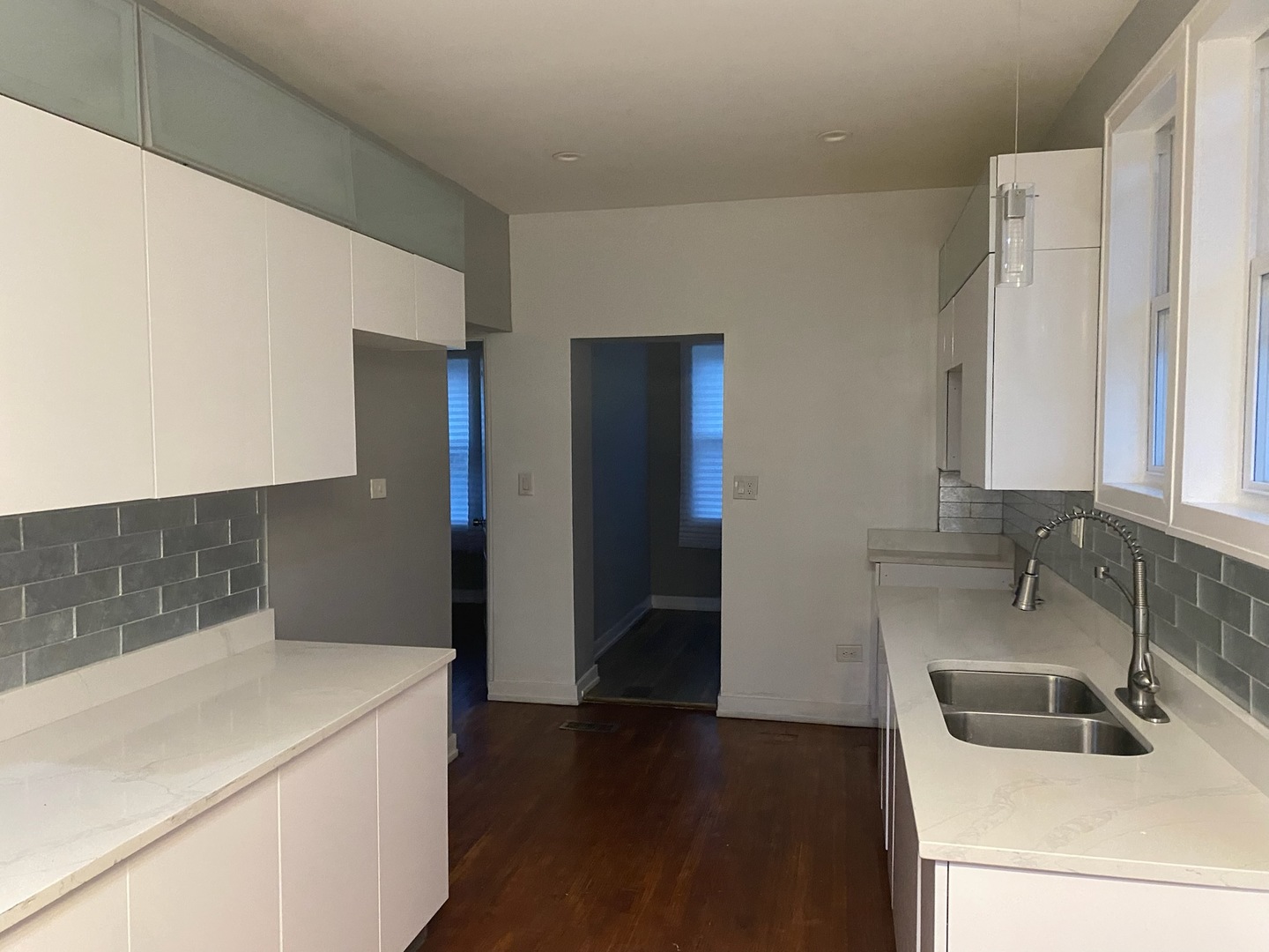 7806 South Rhodes Avenue Chicago, IL 60619 - Photo 18 of 29 a kitchen with a refrigerator and a sink