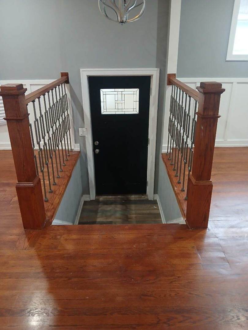 7806 South Rhodes Avenue Chicago, IL 60619 - Photo 2 of 29 a view of entryway and hall with wooden floor