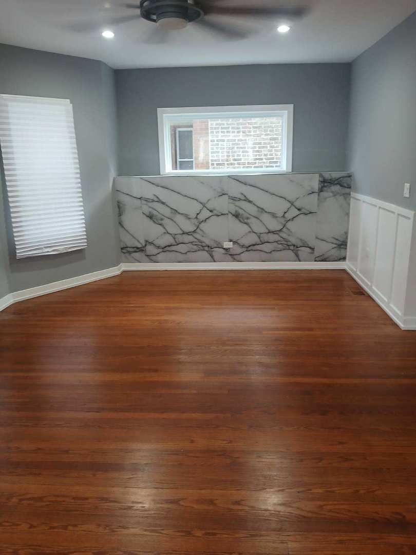 7806 South Rhodes Avenue Chicago, IL 60619 - Photo 8 of 29 a view of a room and wooden floor