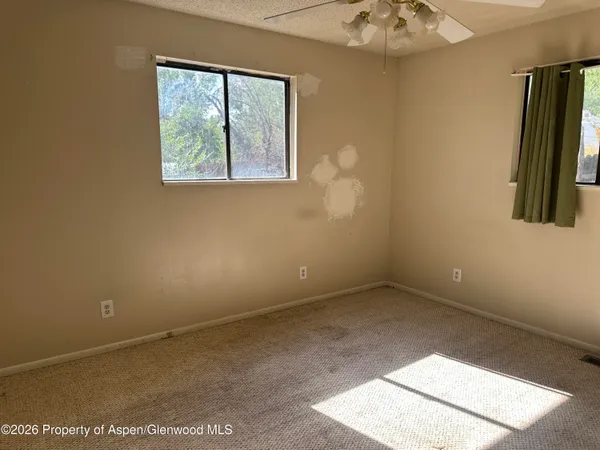 an empty room with windows