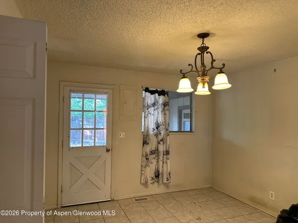 a view of a room with a chandelier