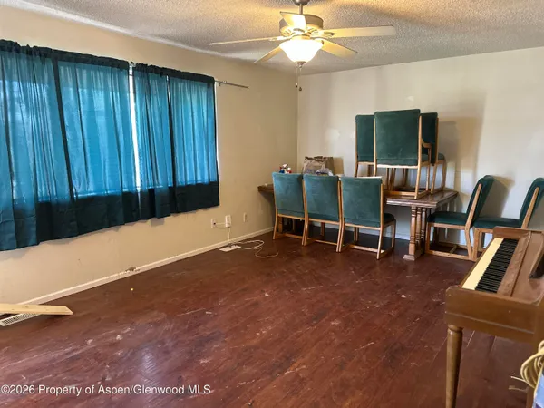 a view of a livingroom with furniture and a flat screen tv