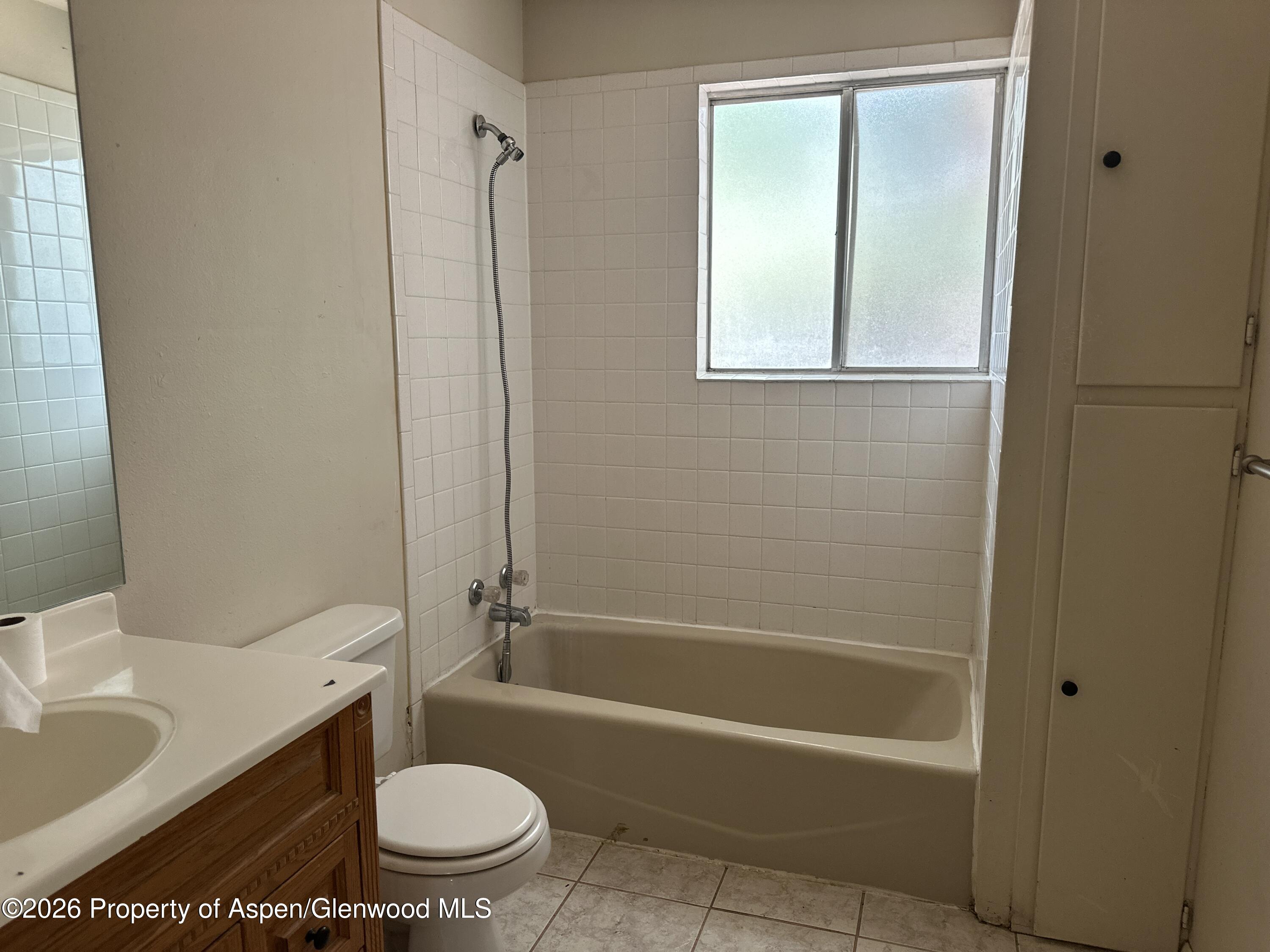 1903 Frontier Drive Craig, CO 81625 - Photo 9 of 16 a bathroom with a sink a toilet and a bathtub