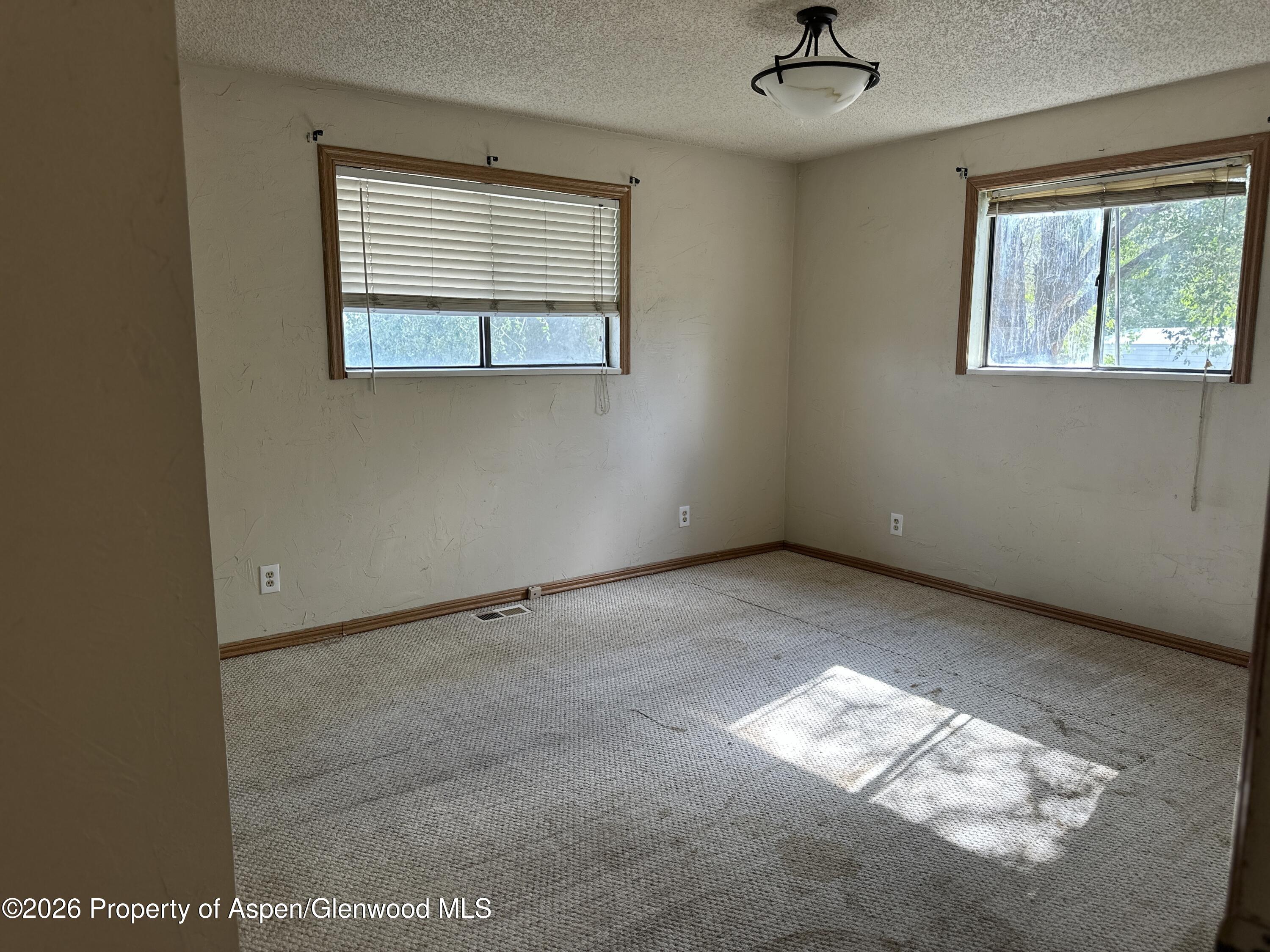 1903 Frontier Drive Craig, CO 81625 - Photo 10 of 16 an empty room with a window