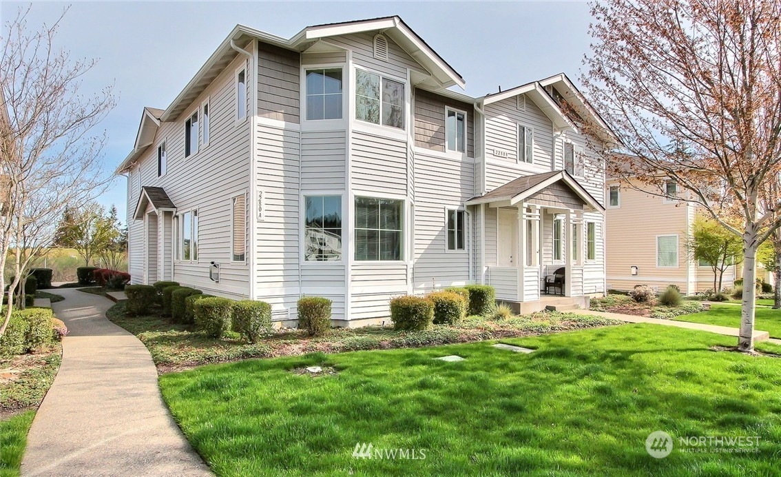 2280 Simmons Street, Unit A DuPont, WA 98327 - Photo 1 of 25 a front view of house with yard and green space