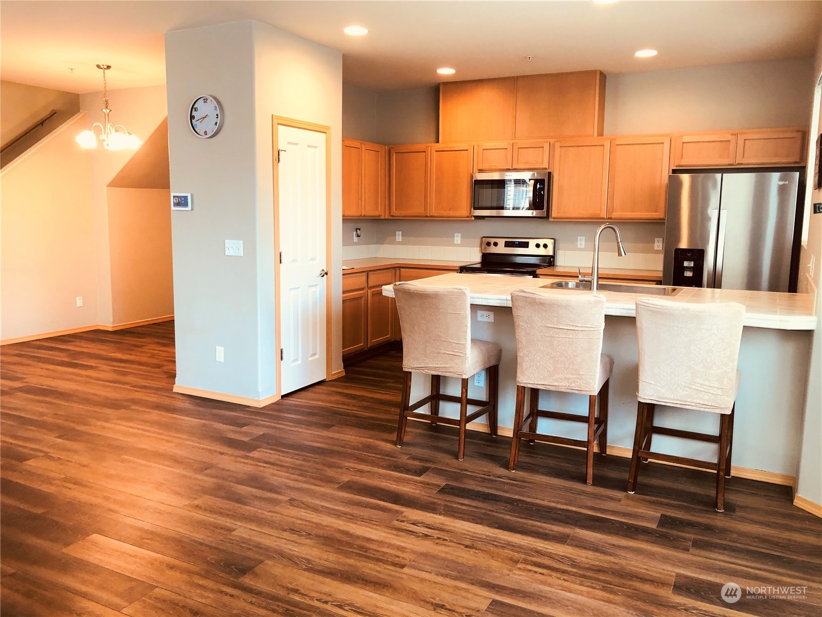 2280 Simmons Street, Unit A DuPont, WA 98327 - Photo 11 of 25 a kitchen with stainless steel appliances a refrigerator and a stove top oven