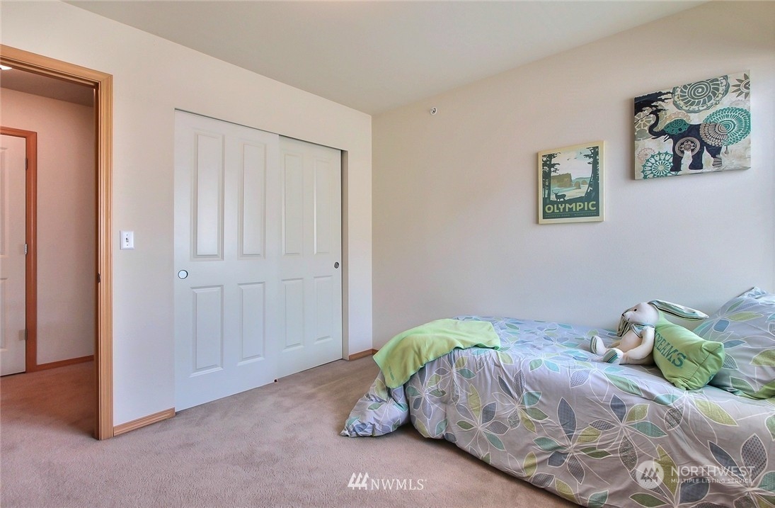 2280 Simmons Street, Unit A DuPont, WA 98327 - Photo 17 of 25 a bedroom with a bed and a window