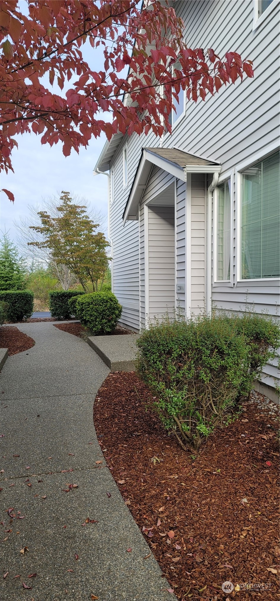 2280 Simmons Street, Unit A DuPont, WA 98327 - Photo 2 of 25 a front view of a house with a yard