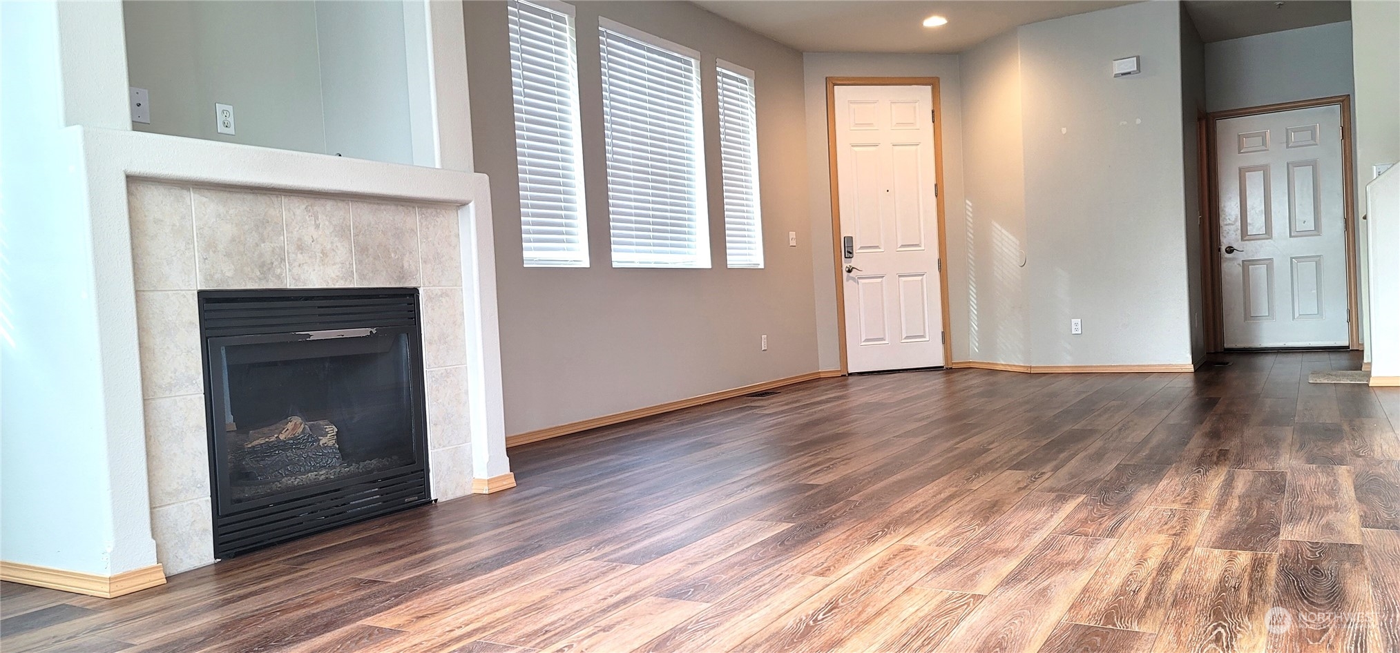 2280 Simmons Street, Unit A DuPont, WA 98327 - Photo 4 of 25 a view of an empty room with wooden floor and a window