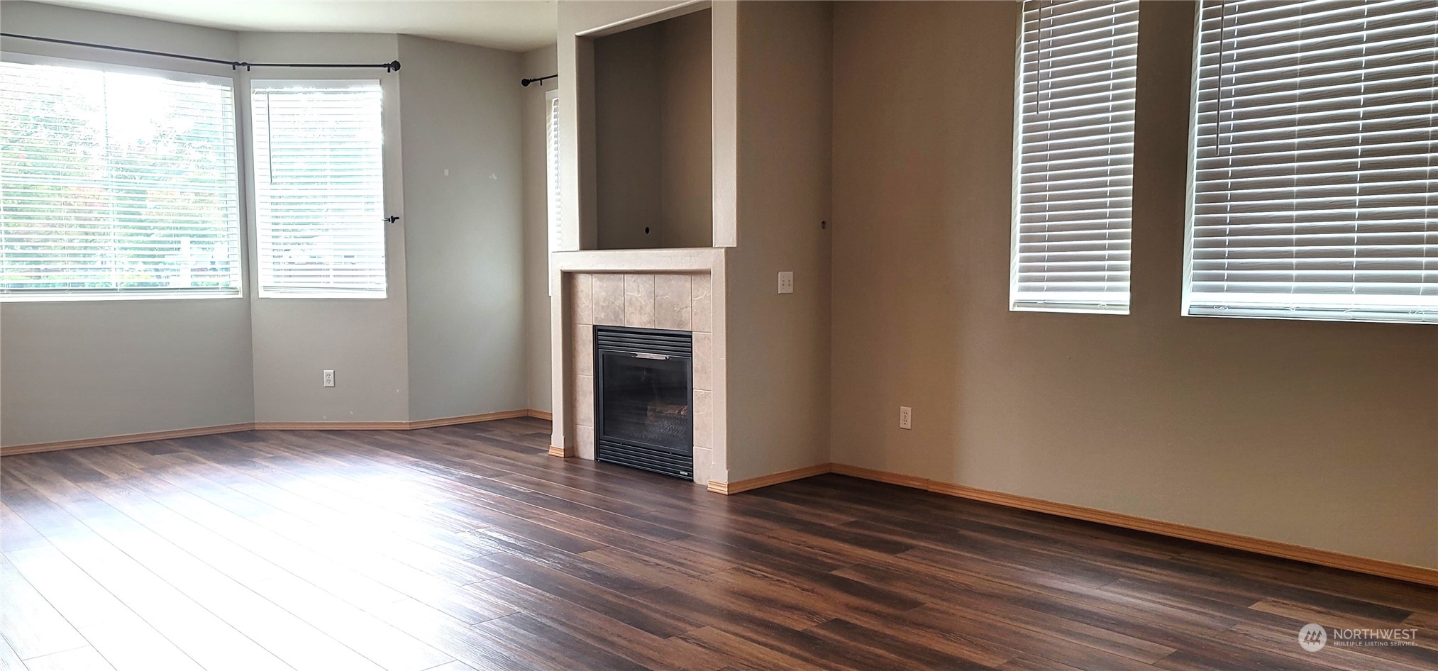 2280 Simmons Street, Unit A DuPont, WA 98327 - Photo 5 of 25 an empty room with wooden floor and windows