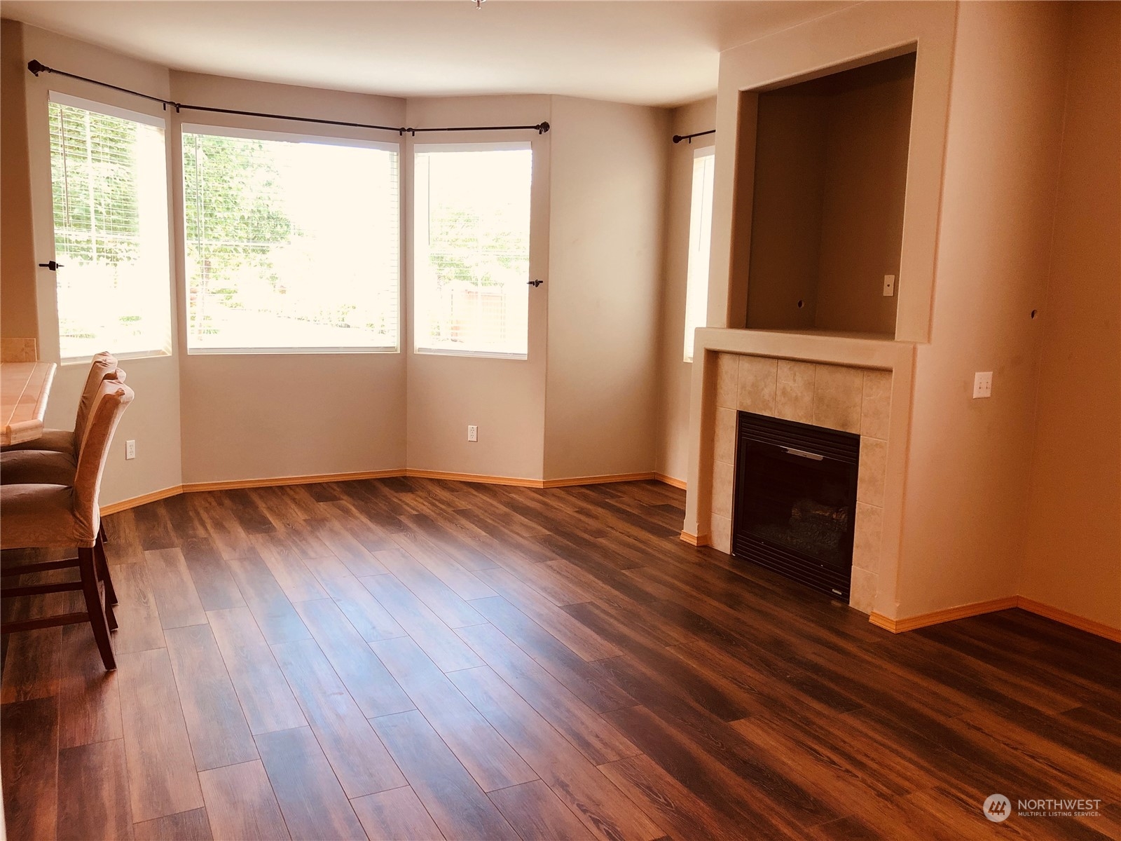 2280 Simmons Street, Unit A DuPont, WA 98327 - Photo 6 of 25 a view of empty room with wooden floor and fireplace