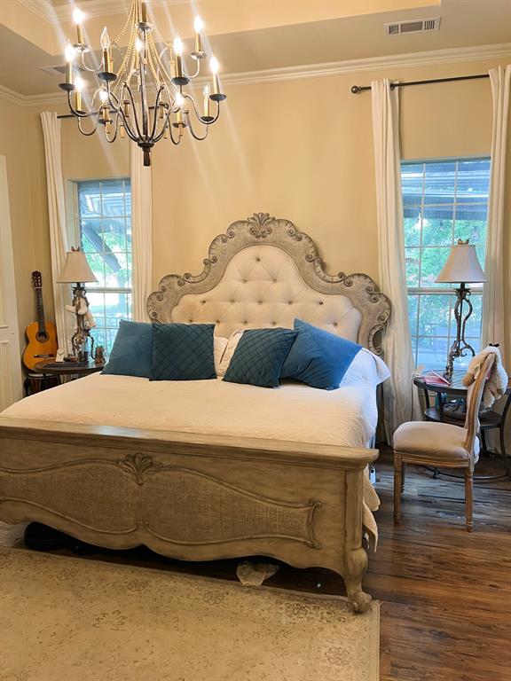 1625 Roma Lane Allen, TX 75013 - Photo 7 of 10 Recessed ceiling with an ornate chandelier, two large windows with drapes, and wood-finish flooring