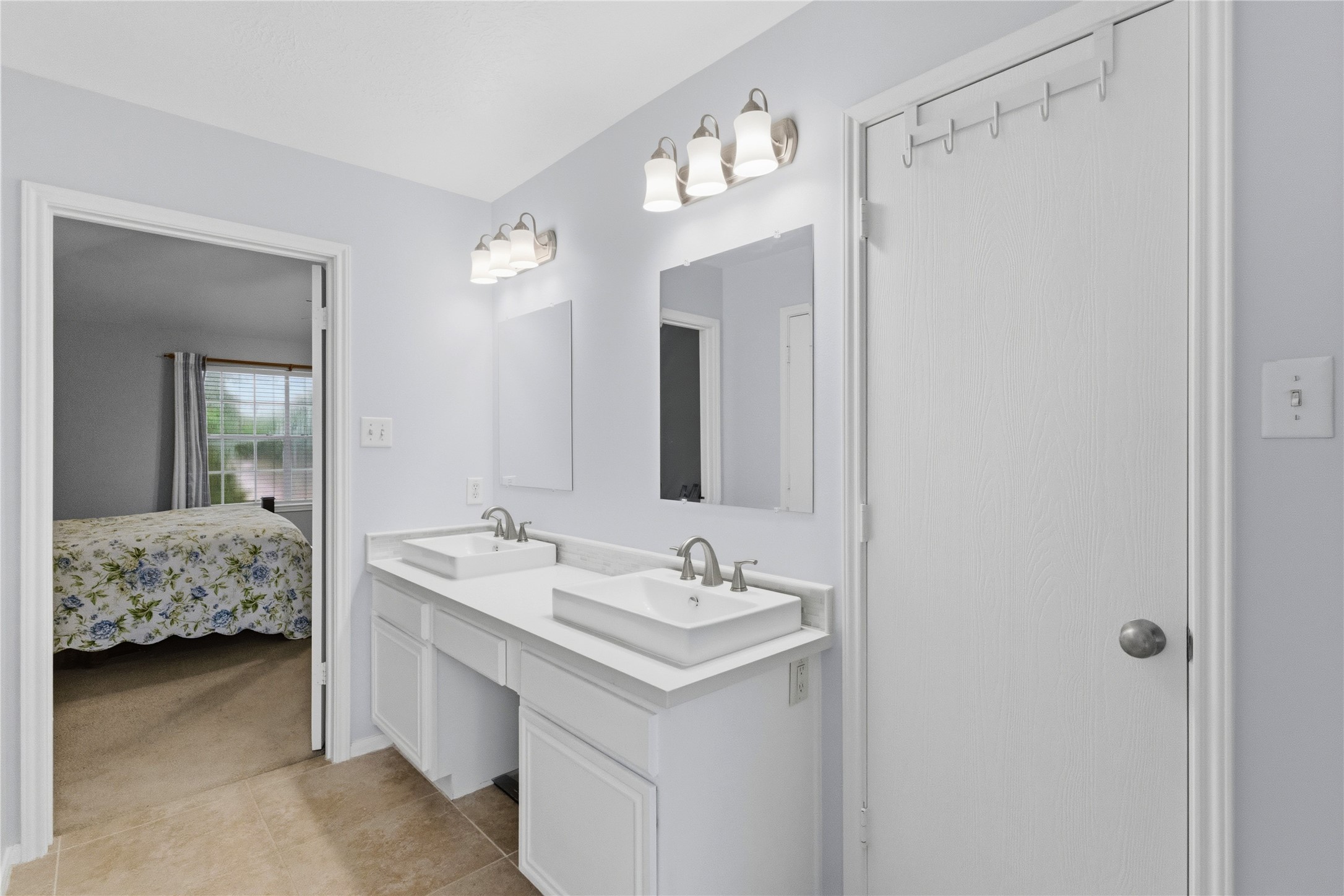 2703 Hidden Spring Vale Drive Spring, TX 77386 - Photo 19 of 29 The primary bathroom offers a large walk in closet providing a convenient space for dressing, ensuring easy access to clothing and accessories.