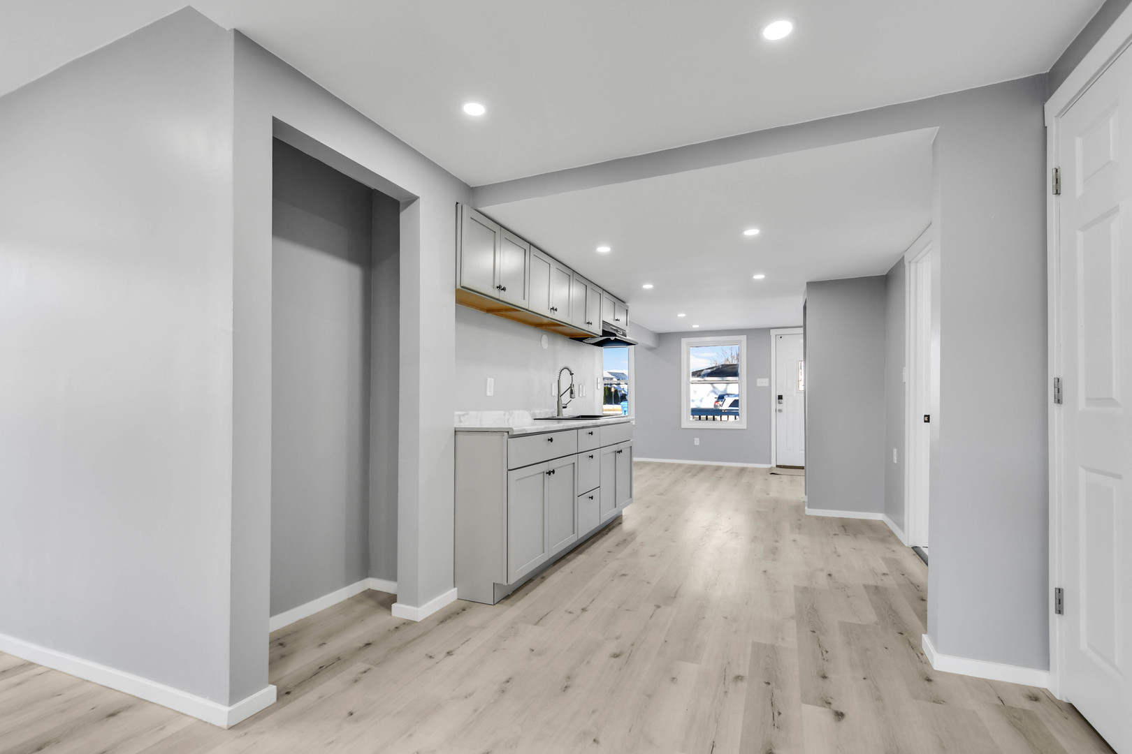 3813 Morgan Street Steger, IL 60475 - Photo 8 of 23 a large kitchen with a lot of counter space and wooden floor