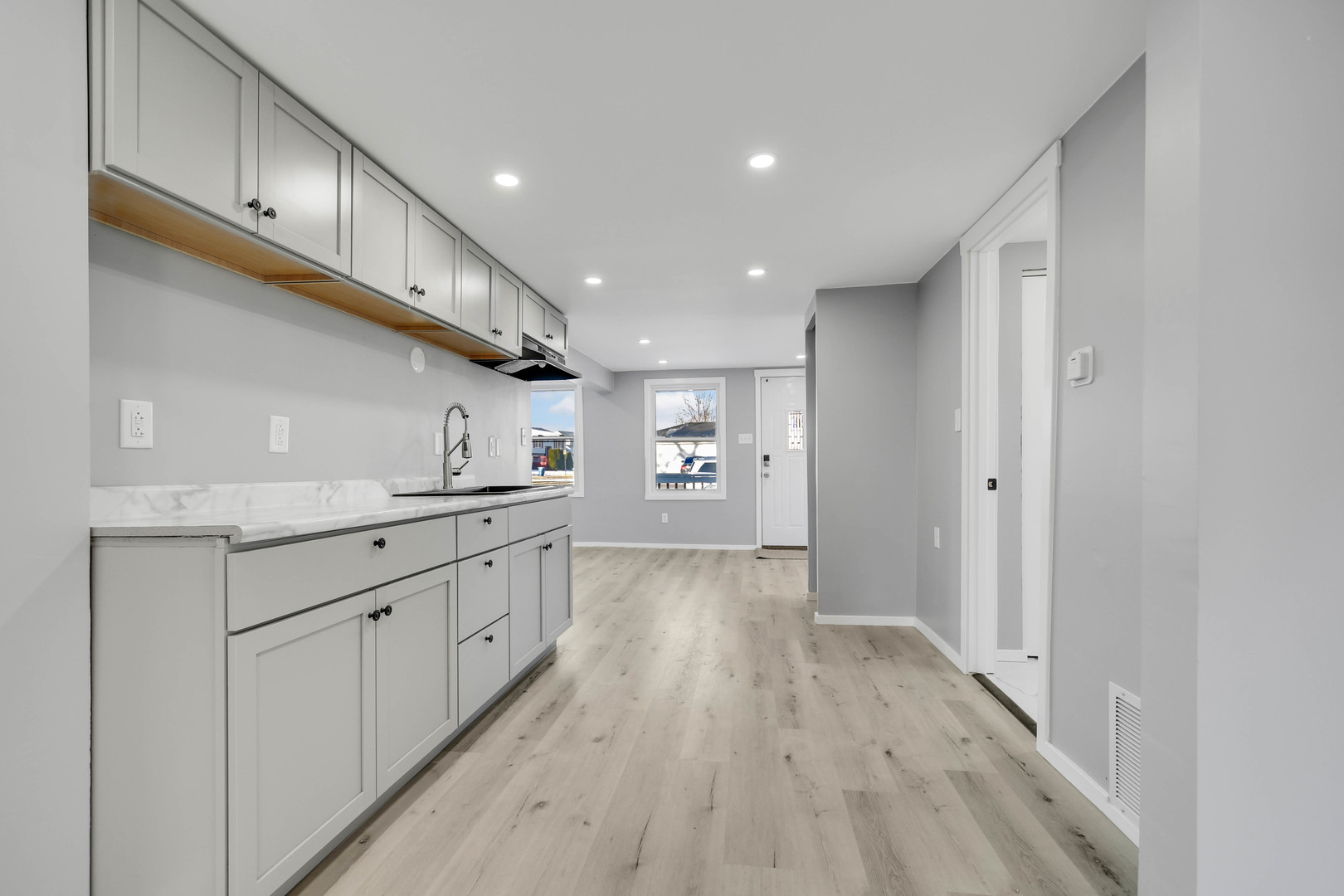 3813 Morgan Street Steger, IL 60475 - Photo 9 of 23 a kitchen with cabinets and wooden floor