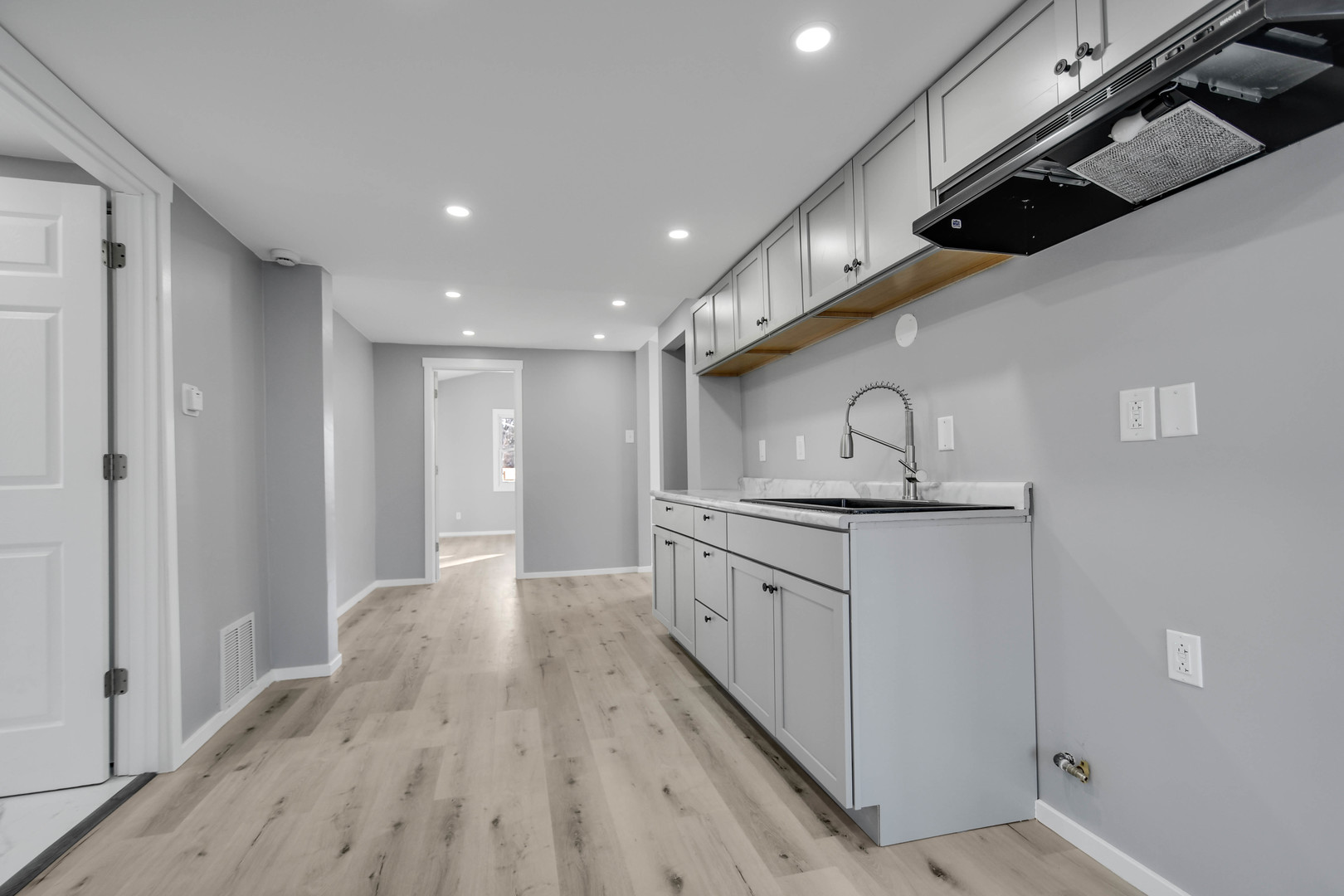 3813 Morgan Street Steger, IL 60475 - Photo 10 of 23 a kitchen with stainless steel appliances granite countertop a sink and a refrigerator