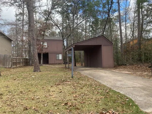 a house with trees in the background