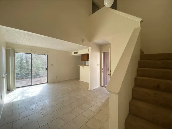 a view of a room with stairs