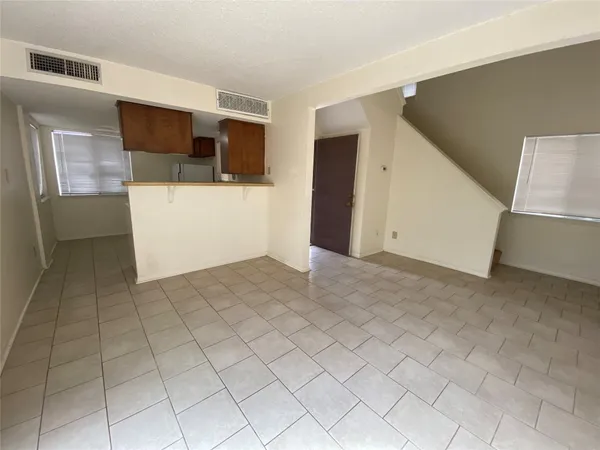 a view of a livingroom with furniture and storage
