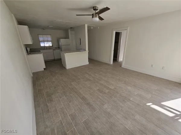 a view of a livingroom with a kitchen