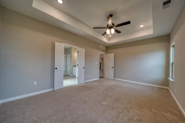 a spacious bathroom with a granite countertop sink mirror and double