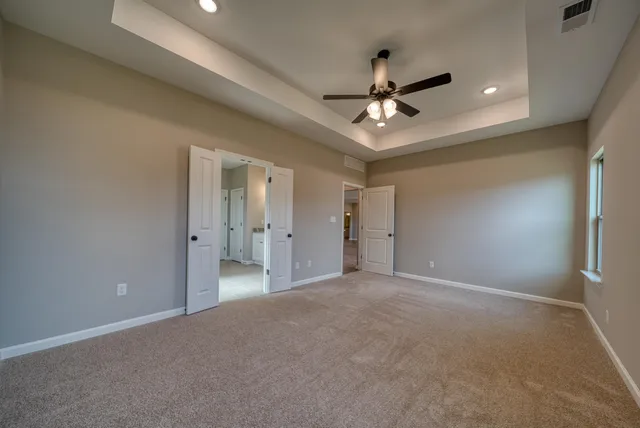a spacious bathroom with a granite countertop sink mirror and double