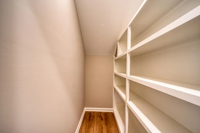a view of an entryway with wooden floor