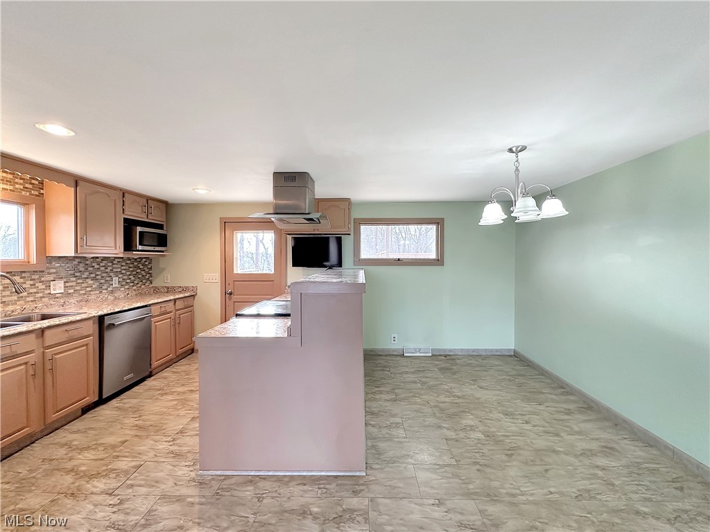 2692 Race Track Road New Cumberland, WV 26047 - Photo 11 of 25 Kitchen featuring a chandelier, appliances with stainless steel finishes, light tile floors, and pendant lighting
