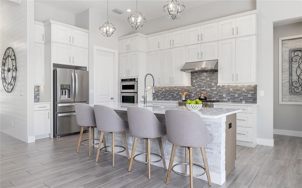 8362 Redonda Loop Bradenton, FL 34202 - Photo 12 of 58 a view of kitchen with refrigerator and window