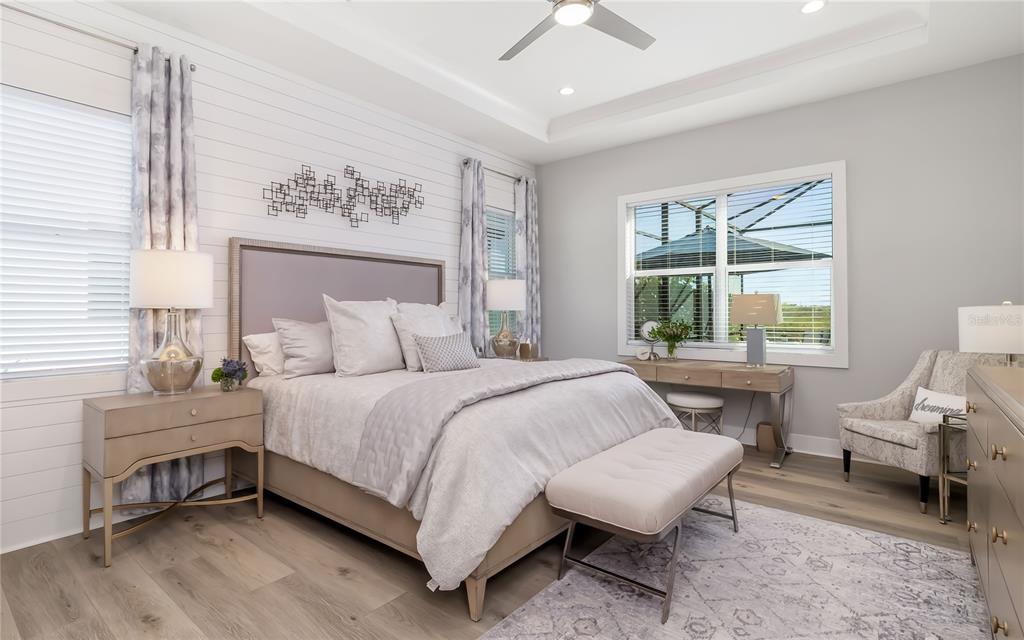 8362 Redonda Loop Bradenton, FL 34202 - Photo 18 of 58 a bedroom with a bed wooden floor and a window