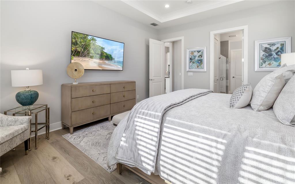 8362 Redonda Loop Bradenton, FL 34202 - Photo 20 of 58 a bedroom with a bed and a dresser