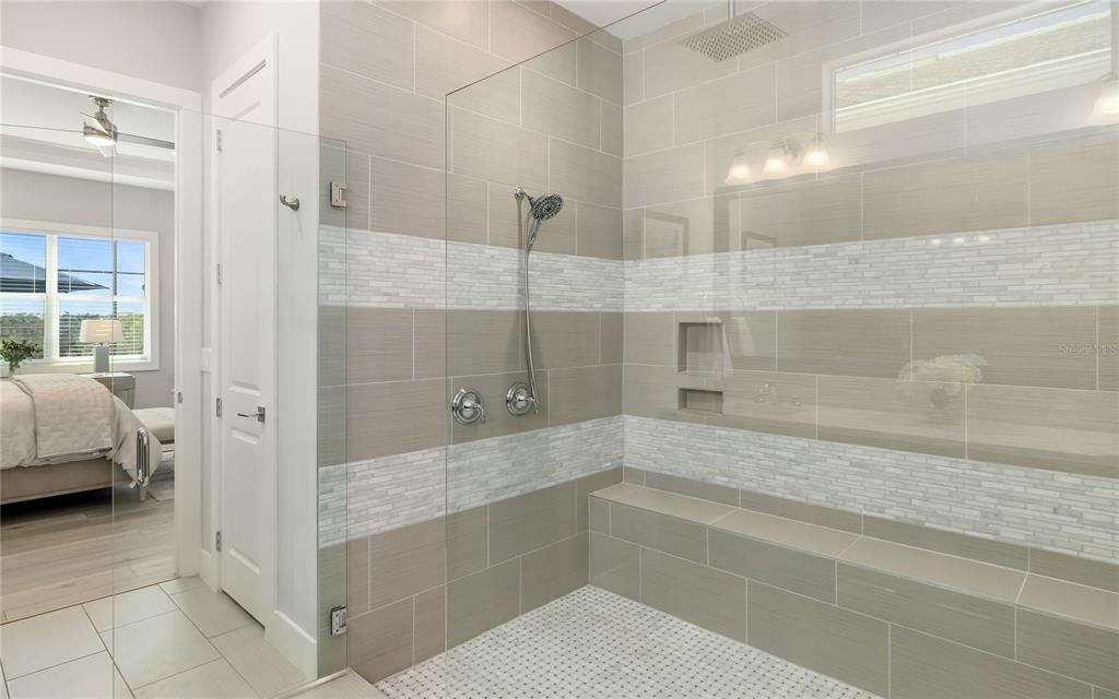 8362 Redonda Loop Bradenton, FL 34202 - Photo 21 of 58 a bathroom with a tub and shower