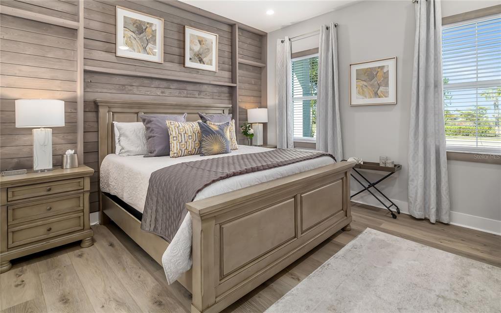 8362 Redonda Loop Bradenton, FL 34202 - Photo 23 of 58 a bedroom with a bed and a cabinets