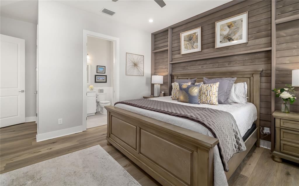 8362 Redonda Loop Bradenton, FL 34202 - Photo 25 of 58 a bedroom with a bed and wooden floor