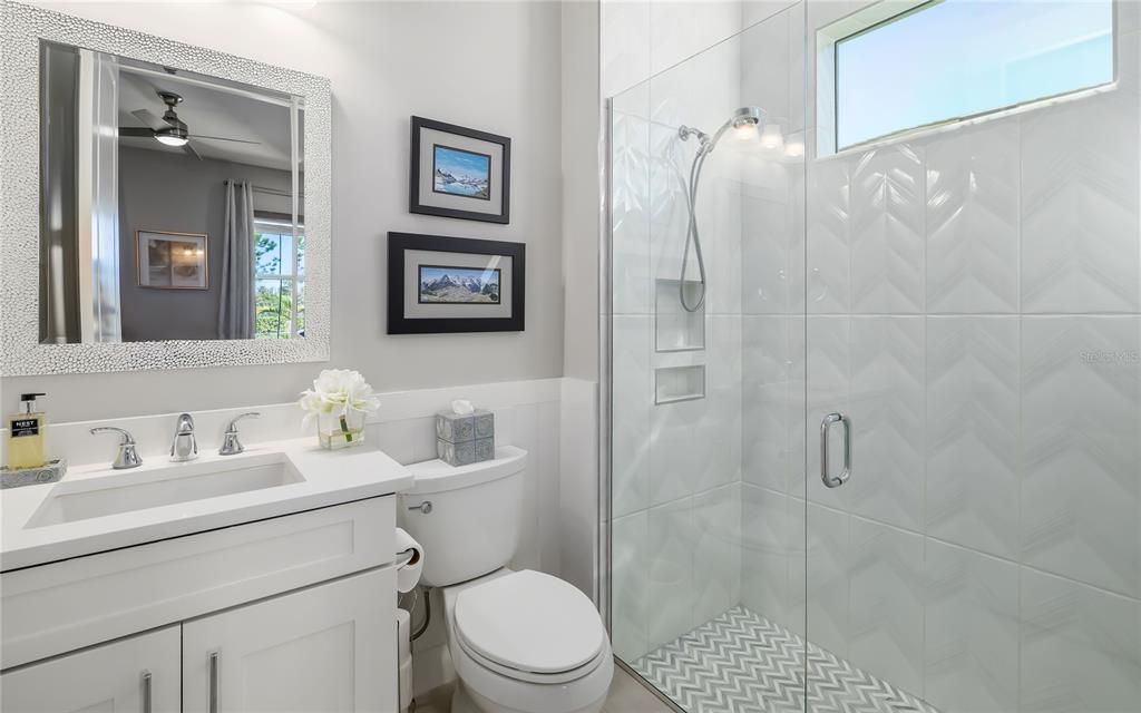 8362 Redonda Loop Bradenton, FL 34202 - Photo 26 of 58 a bathroom with a sink toilet and shower