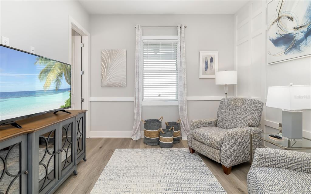 8362 Redonda Loop Bradenton, FL 34202 - Photo 28 of 58 a living room with furniture and a flat screen tv